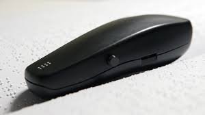 Long, slender, dark gray handheld device with a button on the left side and raised indicator dots on the top front.