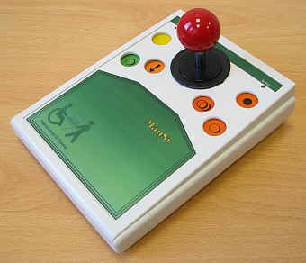 Rectangular device with three colored buttons on each side and a small joystick in the center and a surface below.