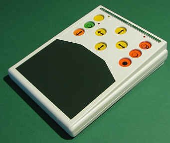 White, long rectangular device with 10 colored buttons on top and a surface area below.