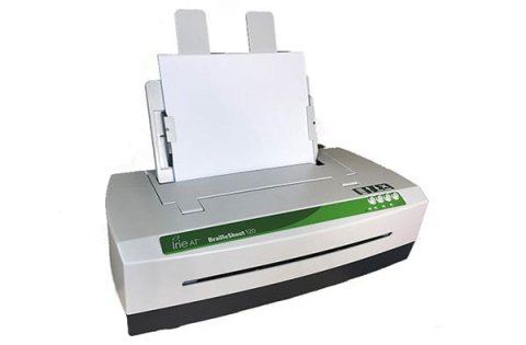 Angled view of white rectangular printer with narrow green control panel on the front and four control knobs on the right. A sheet feeder is in the back.
