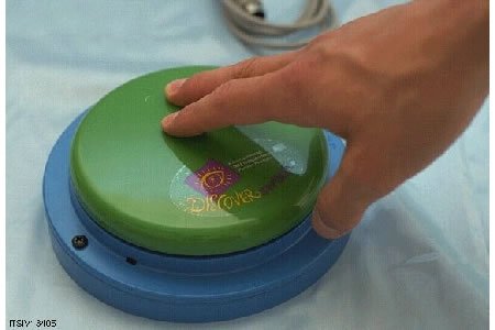 User uses hand to press round button switch, mounted on a round base.