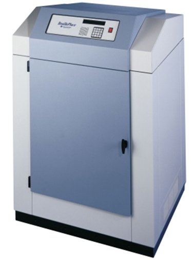 A large standing device that is white and grey in color and resembles a standard copy machine.
