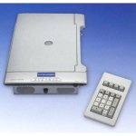 A flat, rectangular device with a speaker and control buttons in the front and a document scanner on top. Beside this device is an eternal keypad.