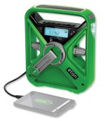 Square radio with a fold-out crank in the center and a carrying handle at the top. There are buttons below the handle and a display on the front.