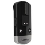 A small oval-shaped black device with a silver tip with the name Cochlear on it. On the front is a large rectangular button with a telephone icon, a small round button labeled "P" and another small round button with a microphone icon. On the side edge is a slide button.