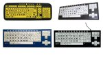 Various models of low-vision keyboards. All models resemble a standard keyboard, but the lettering is larger and bolder (the key size itself is roughly the same). Three of the four keyboards are black; one has yellow keys with black lettering; the other two have white keys with black lettering. The fourth model is dark blue with white keys and black lettering. None have numeric keypads, but they all have arrow navigation keys on the right-hand side.