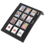 Rectangular black color device which has 12 switches, each switch has person's picture on it.