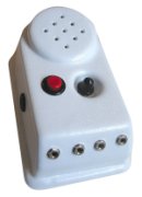 White, medium-sized, and rectangular device with a speaker at the top and various input jacks for connecting switch controls. In the center, there is also a small red button.