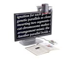 Video magnifier with camera mounted above monitor to read text below and display large print on screen..