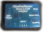 A rectangular device with labels like menu, speaker, USB power along its sides.