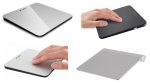 Various models of trackpad mice. They are rectangular in shape and either lay flat or stand at a slight angle. Three models are light silver; one is black.