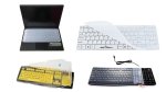 Various models of keyboard covers. All of them are clear, translucent plastic covers that are either designed to fit around a standard desktop computer keyboard, or else they stick directly on top of compact keyboards on a laptop.