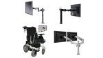 Various models of monitor mounting systems. They resemble flexible arms with attachments on the end to secure a monitor. The arms are attached to a rigid pole. One model has two arms and dual monitors side-by-side. Another is smaller and attached to a power wheelchair armrest. One model is black; three are silver.