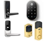 Various models of smart door locks. Three of the models resemble standard door locks, but with number keypads. Two of the models also have built-in fingerprint scanners. One smart lock model features two components: the first is a standard lock that is operated with a key; the second is a turn-lock. Both style locks have the number keypads at the top.  Another model is a small oval-shaped number keypad with no physical lock on it at all. That model is black; two are silver, and another is gold.