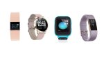 Various models of activity tracker watches. They resemble standard watches with digital screens. Two of the screens are small and square; they’re displaying the time and date, and one of them is also displaying heart rate. Another has a large round display, which is showing the time, date, battery life indicator, and step count. A fourth model has a large square display, which is showing the time, date, and a wallpaper graphic. One watch band is light pink; two are lavender; and one is blue.