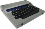 A large grey-nd black TTY that resembles an electric typewriter.