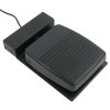 A black rectangular pedal with a cord attached to the front.