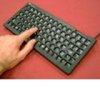 Small black keyboard with a keyguard.