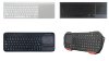 Various models of keyboards with built-in trackpads. Three models resemble a standard keyboard, but include medium-to-large sized trackpads embedded on the right-hand side. The fourth model is smaller, with angled corners rather than rectangular corners. Its keys are smaller than standard, and its small, built-in trackpad is on the upper left-hand side. It has two built-in red "legs" for standing up the device. One model is white; the other three are black.