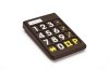 Black rectangular keypad with white and yellow number and symbol keys.