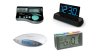 Several different models of talking clocks. They resemble standard digital alarm clocks, but some have additional color-coded menu buttons. One model displays both the time as well as the date and day of the week.