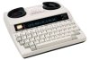 Off-white TTY telephone, resembling an electric typewriter.